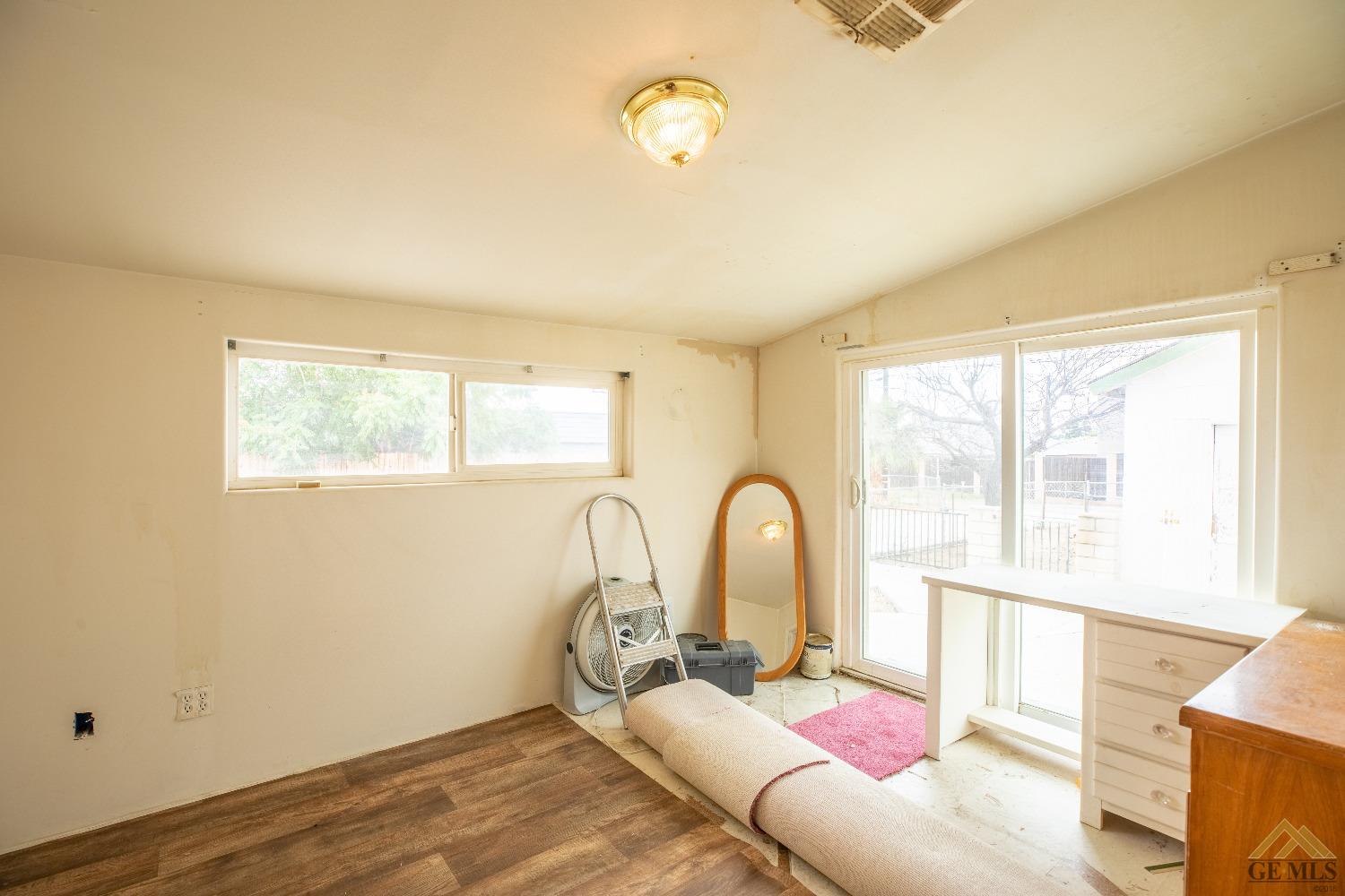 Undisclosed Address Taft, CA 93268 - Photo 11 of 24 a bed room with a bed and a window