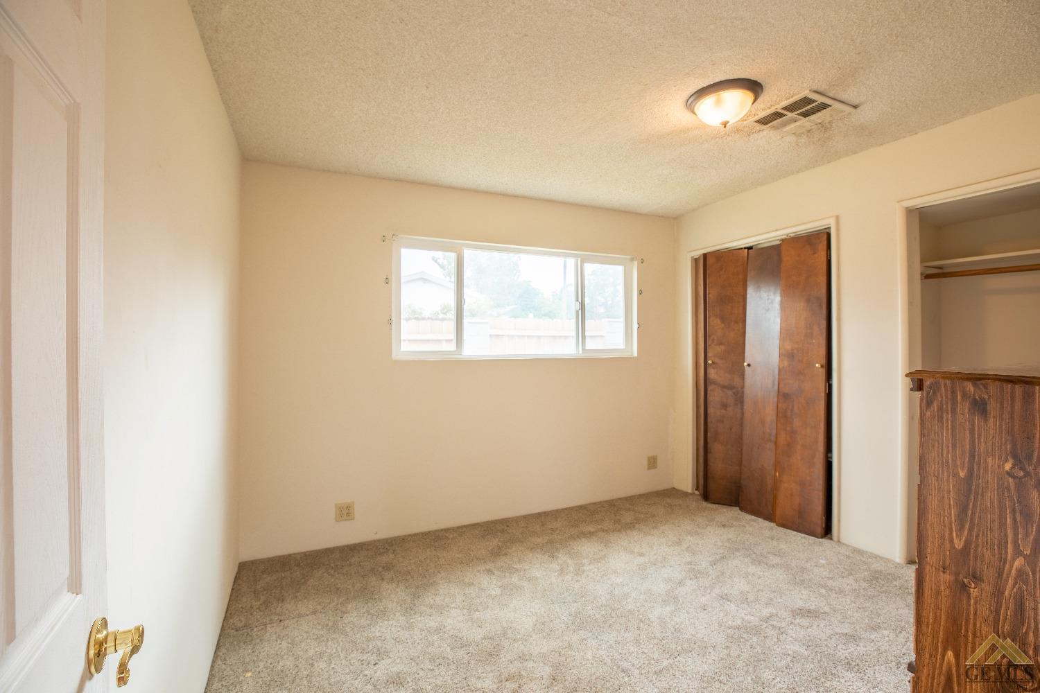 Undisclosed Address Taft, CA 93268 - Photo 12 of 24 a view of an empty room with a window