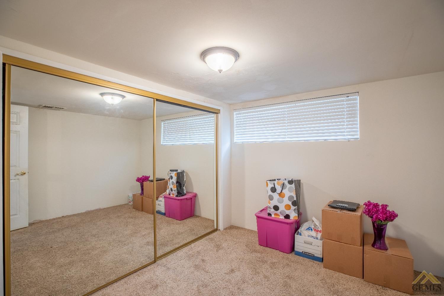 Undisclosed Address Taft, CA 93268 - Photo 15 of 24 a bedroom with furniture and flowers