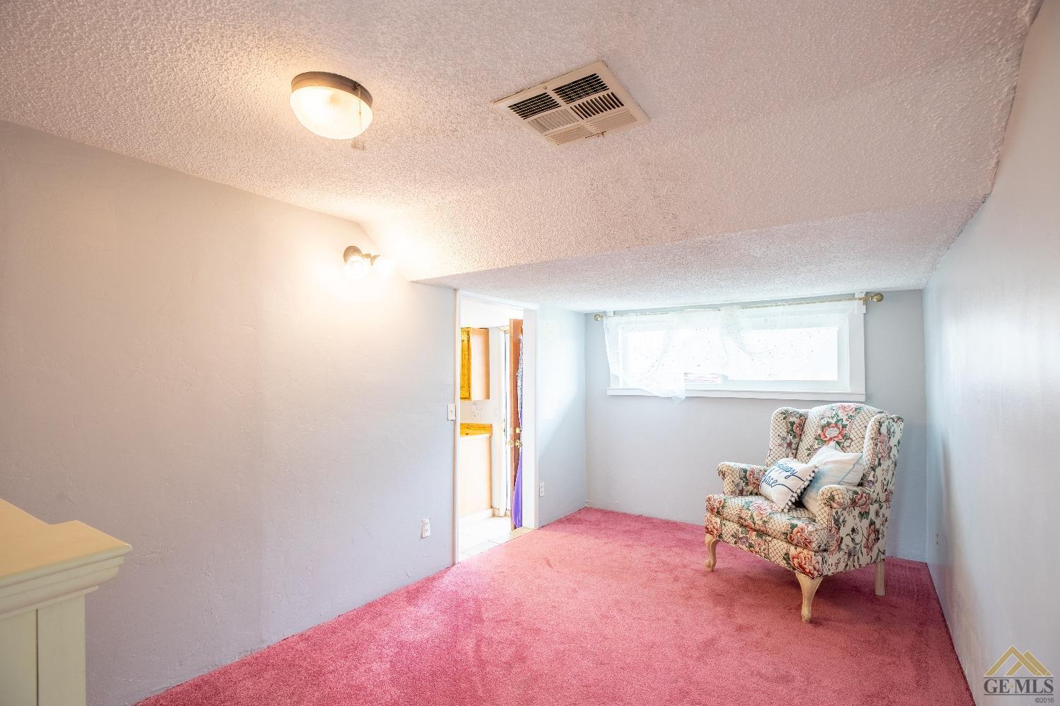 Undisclosed Address Taft, CA 93268 - Photo 17 of 24 a bedroom with a bed and a couch