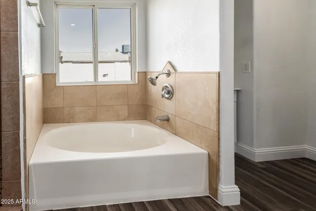 a bathroom with a shower and a bathtub