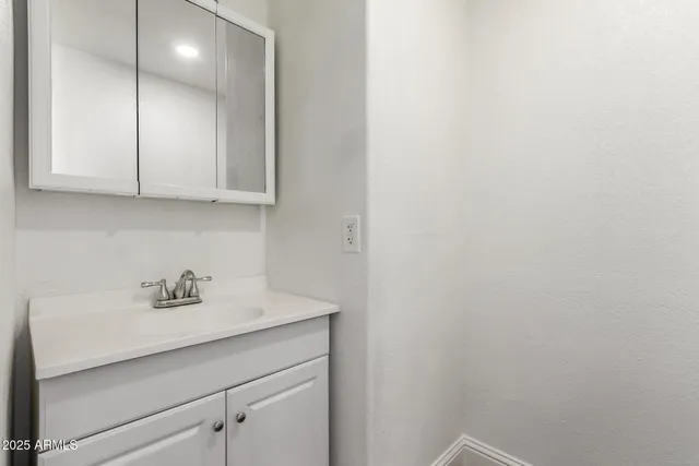 a view of a hallway view with wooden floor and staircase
