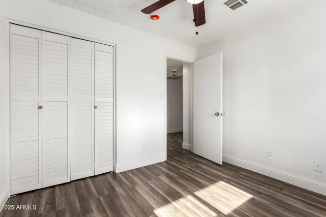 a white toilet and shower