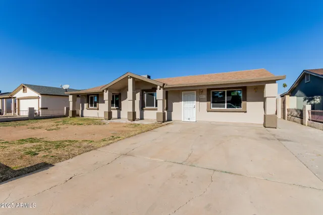 a front view of a house with garage