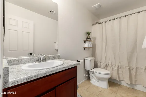 a bathroom with a sink and a washer dryer
