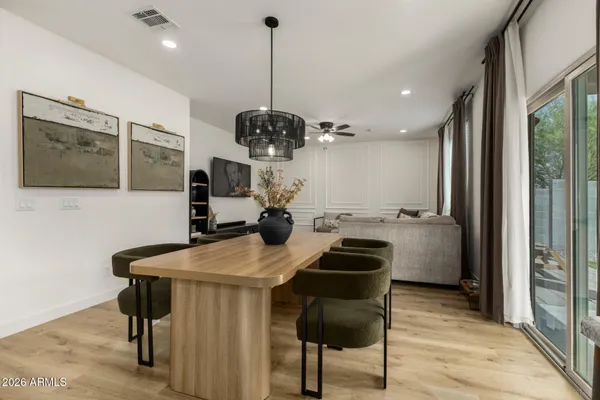 a kitchen with a table chairs sink and stove