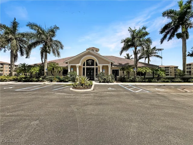 a view of swimming pool with outdoor seating and lake