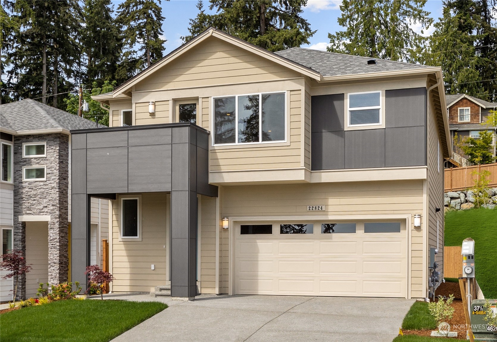 3823 198th Place Southeast Bothell, WA 98012 - Photo 33 of 33 a view of a white house with large windows