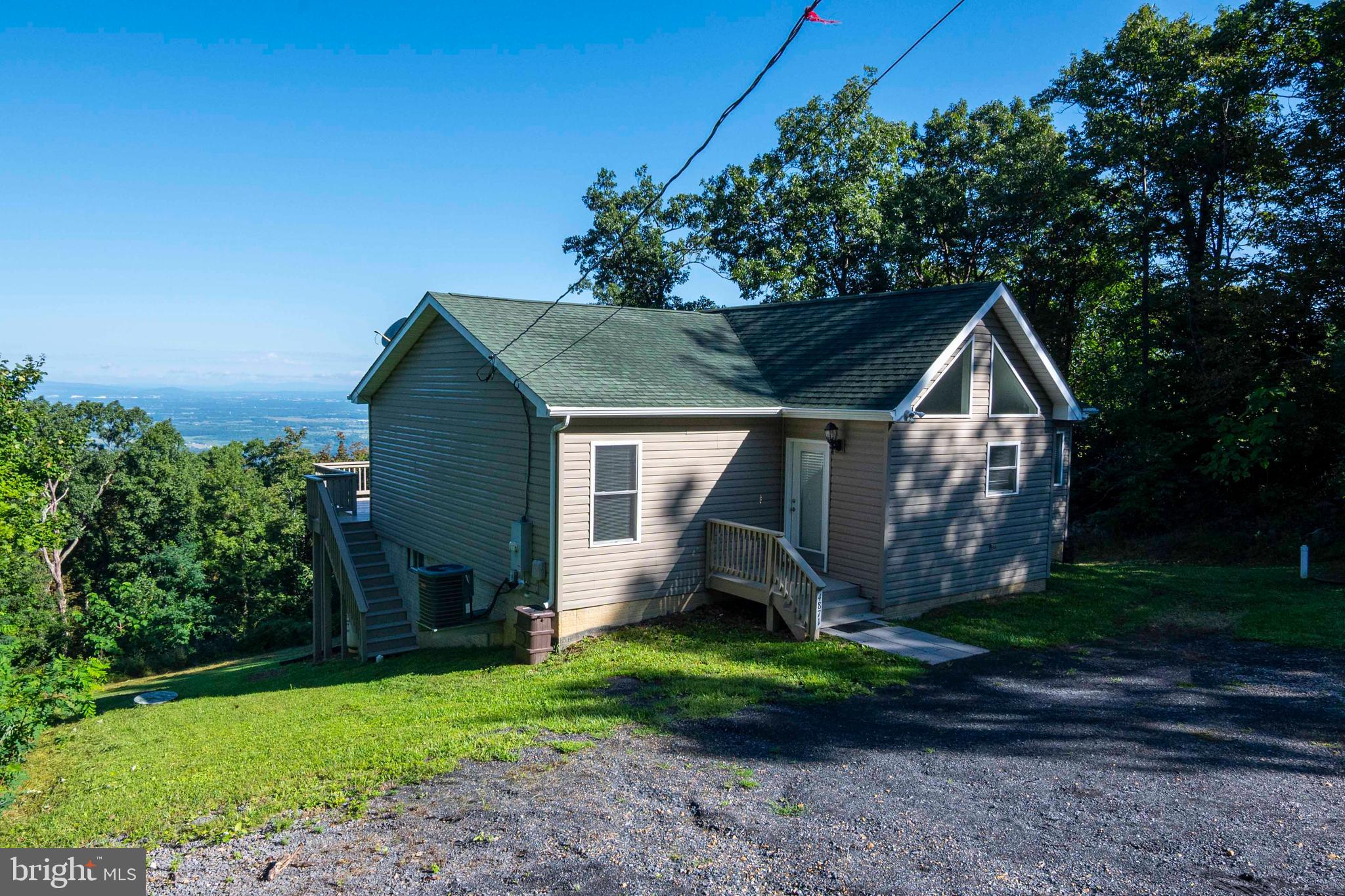 4871 Blue Mountain Road Linden, VA 22642 - Photo 13 of 73 a view of a house with a yard and plants