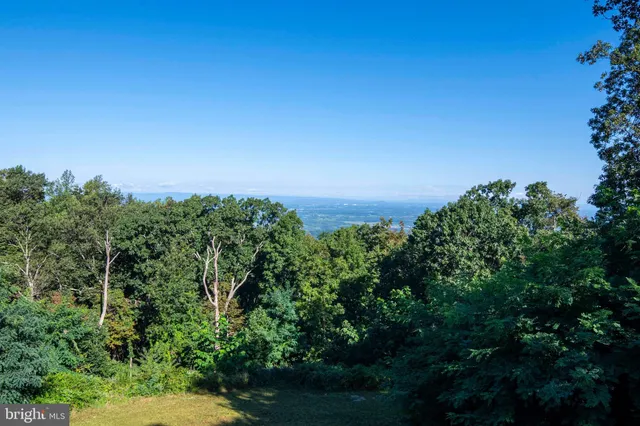 a view of balcony with wooden floor