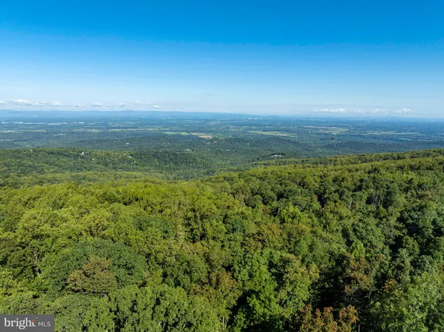 a view of an ocean and mountain