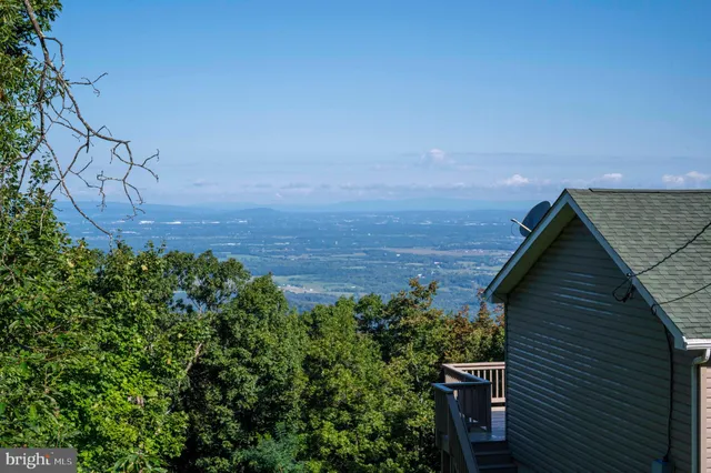 a view of a lake with a building in the background