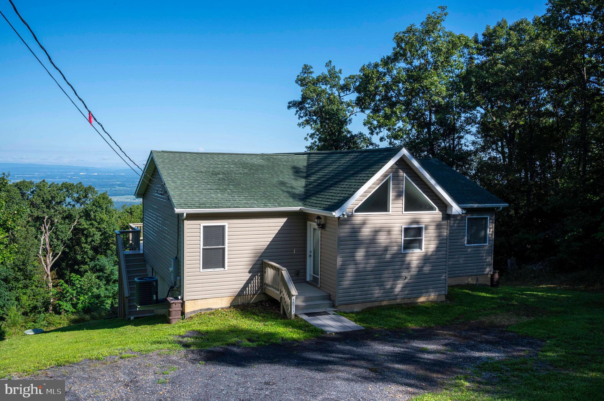 4871 Blue Mountain Road Linden, VA 22642 - Photo 25 of 73 a front view of a house with a yard