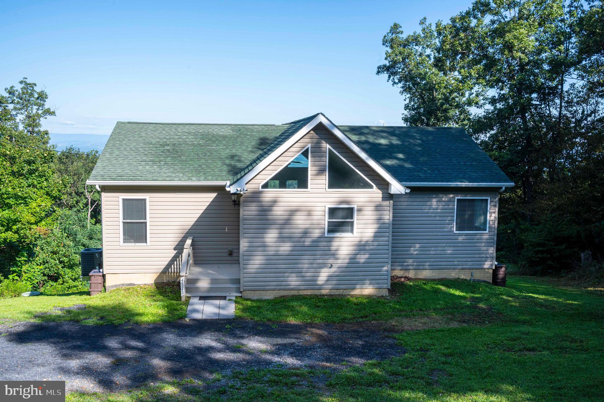 4871 Blue Mountain Road Linden, VA 22642 - Photo 26 of 73 a front view of a house with garden