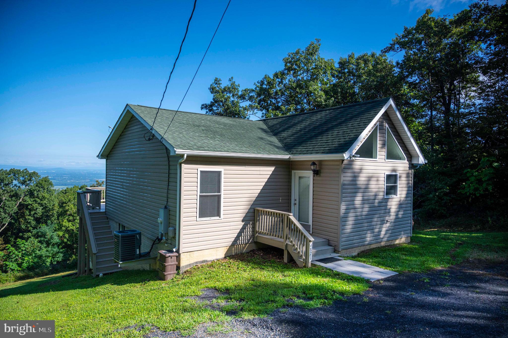 4871 Blue Mountain Road Linden, VA 22642 - Photo 27 of 73 a house view with a garden and deck