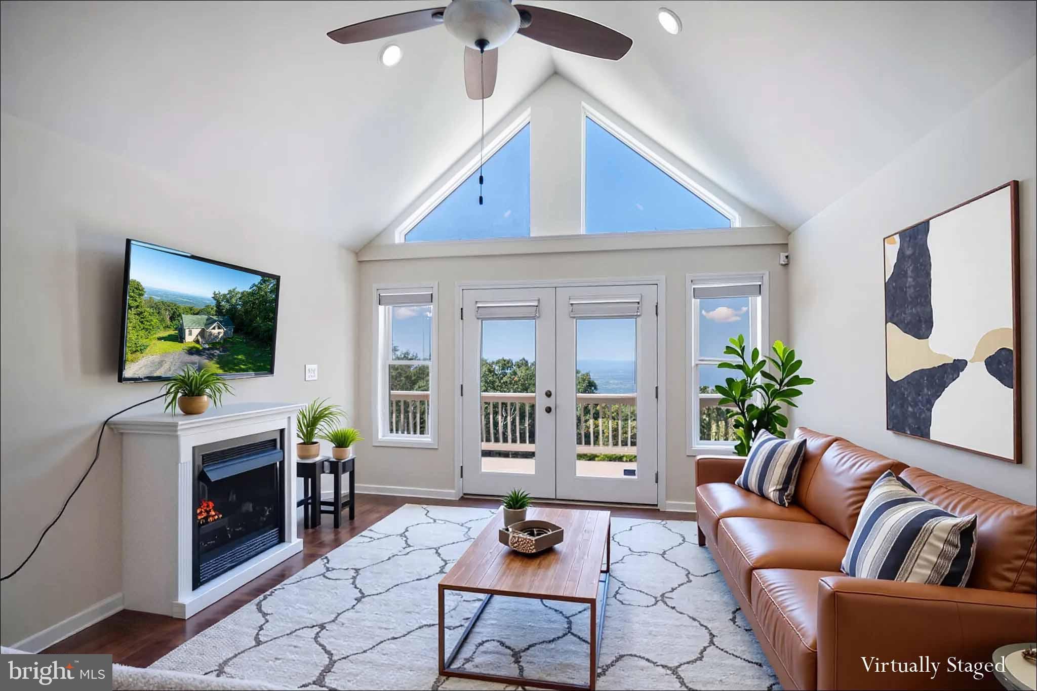 4871 Blue Mountain Road Linden, VA 22642 - Photo 37 of 73 a living room with furniture and a flat screen tv