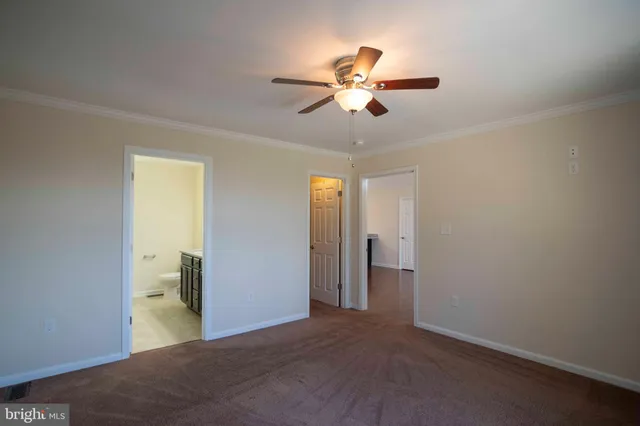 a view of a room with furniture and wooden floor