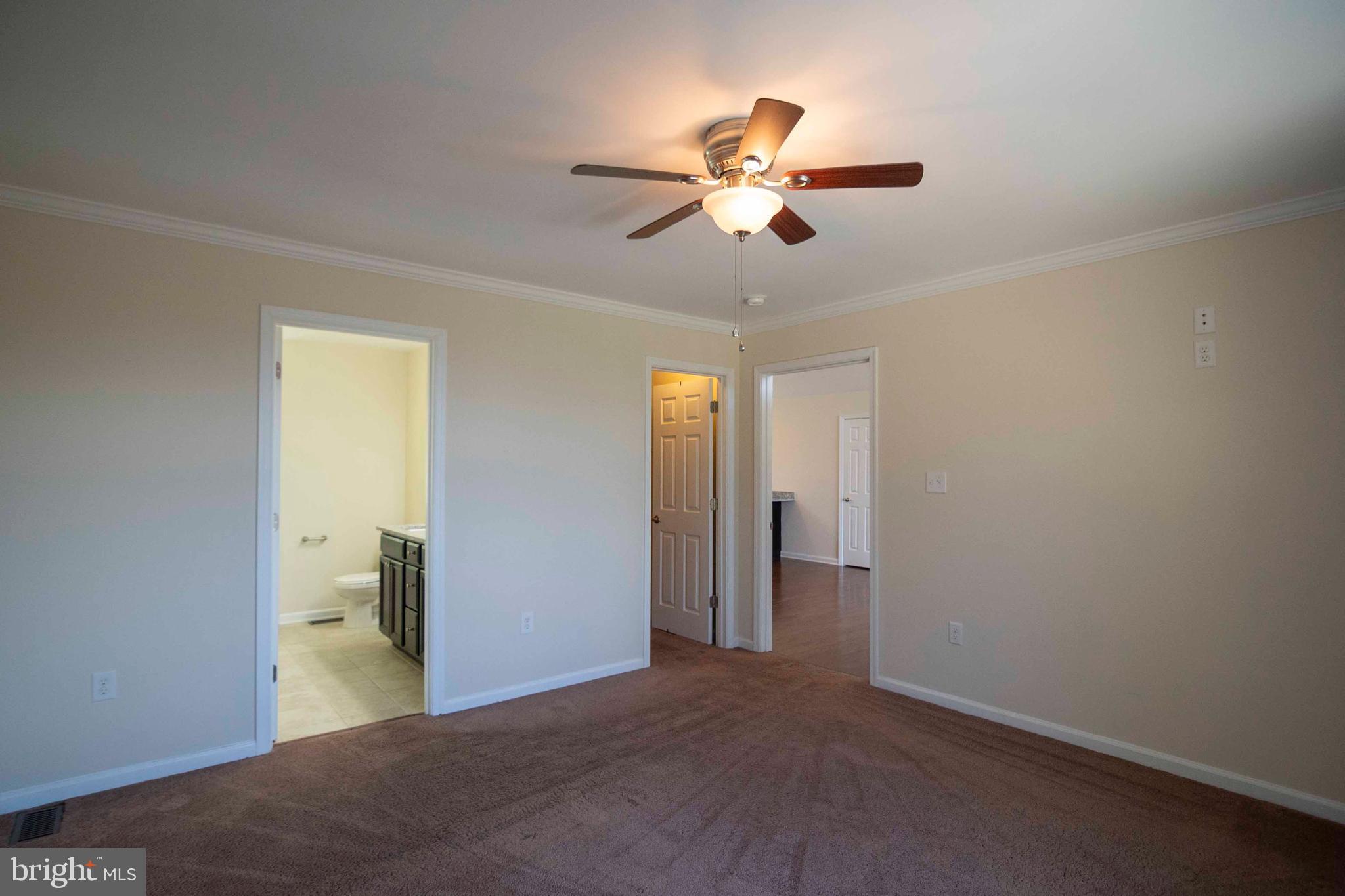 4871 Blue Mountain Road Linden, VA 22642 - Photo 43 of 73 a view of a livingroom with a chandelier fan and windows