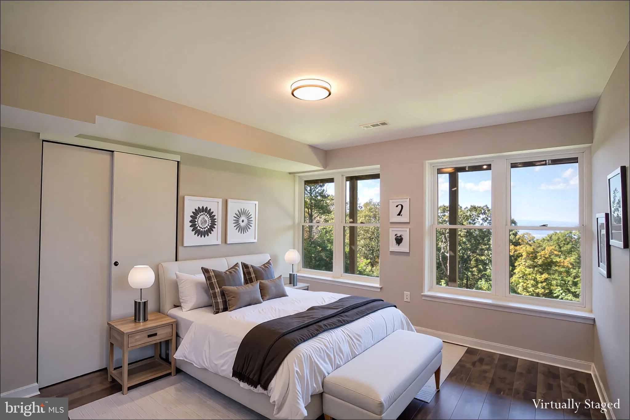 4871 Blue Mountain Road Linden, VA 22642 - Photo 52 of 73 a spacious bedroom with a large bed and a window