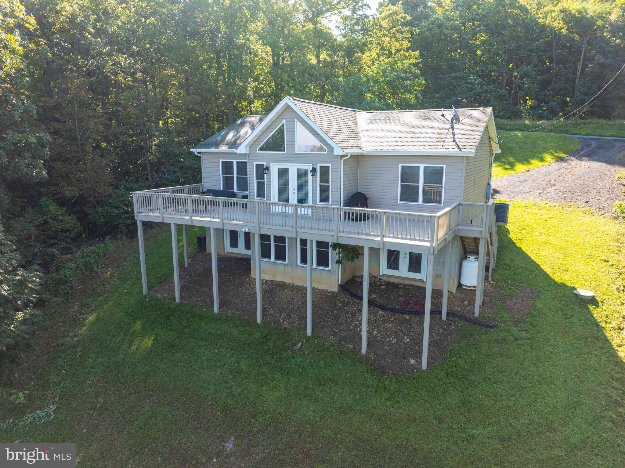 4871 Blue Mountain Road Linden, VA 22642 - Photo 8 of 73 a view of a house with a yard porch and sitting area