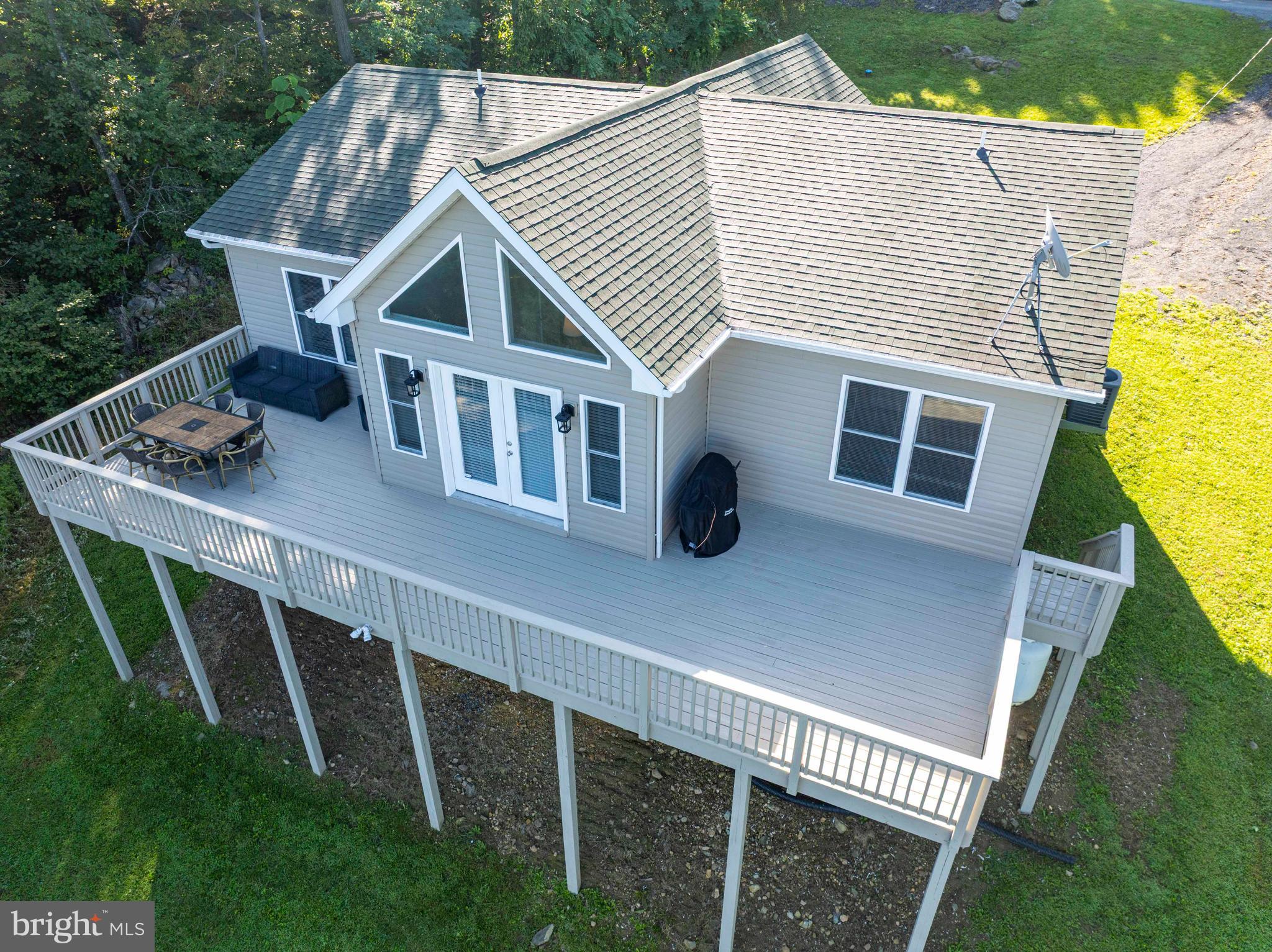 4871 Blue Mountain Road Linden, VA 22642 - Photo 10 of 73 a view of a house with backyard and deck