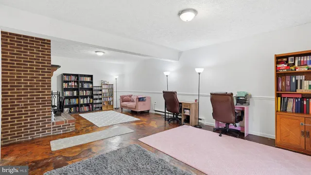 a view of a workspace with furniture