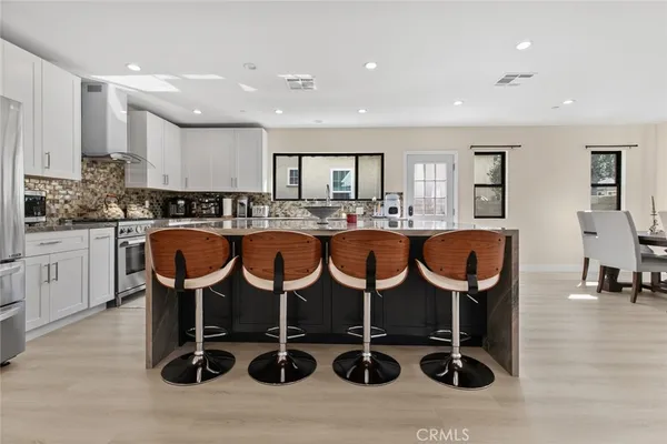 a close view of a utility room with dryer and washer