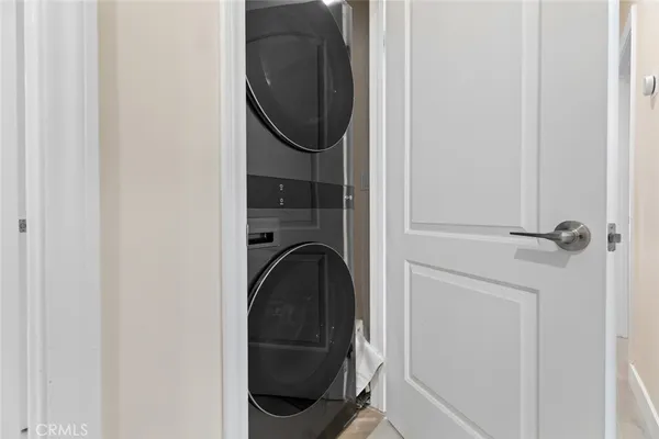 a bedroom with a bed and a mirror