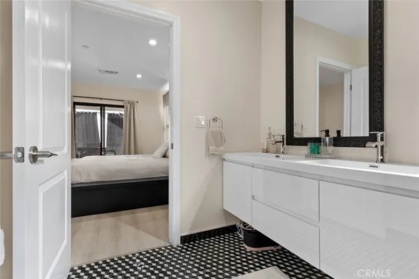 a view of kitchen with stainless steel appliances a refrigerator and a stove top oven