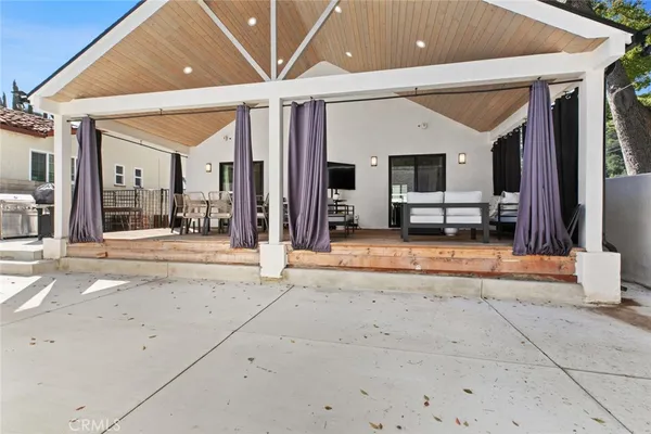 an aerial view of a house with a yard basket ball court and outdoor seating