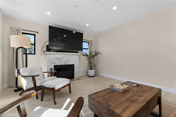 a view of a livingroom with furniture and a window