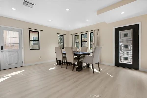 a view of a dining room with furniture and window