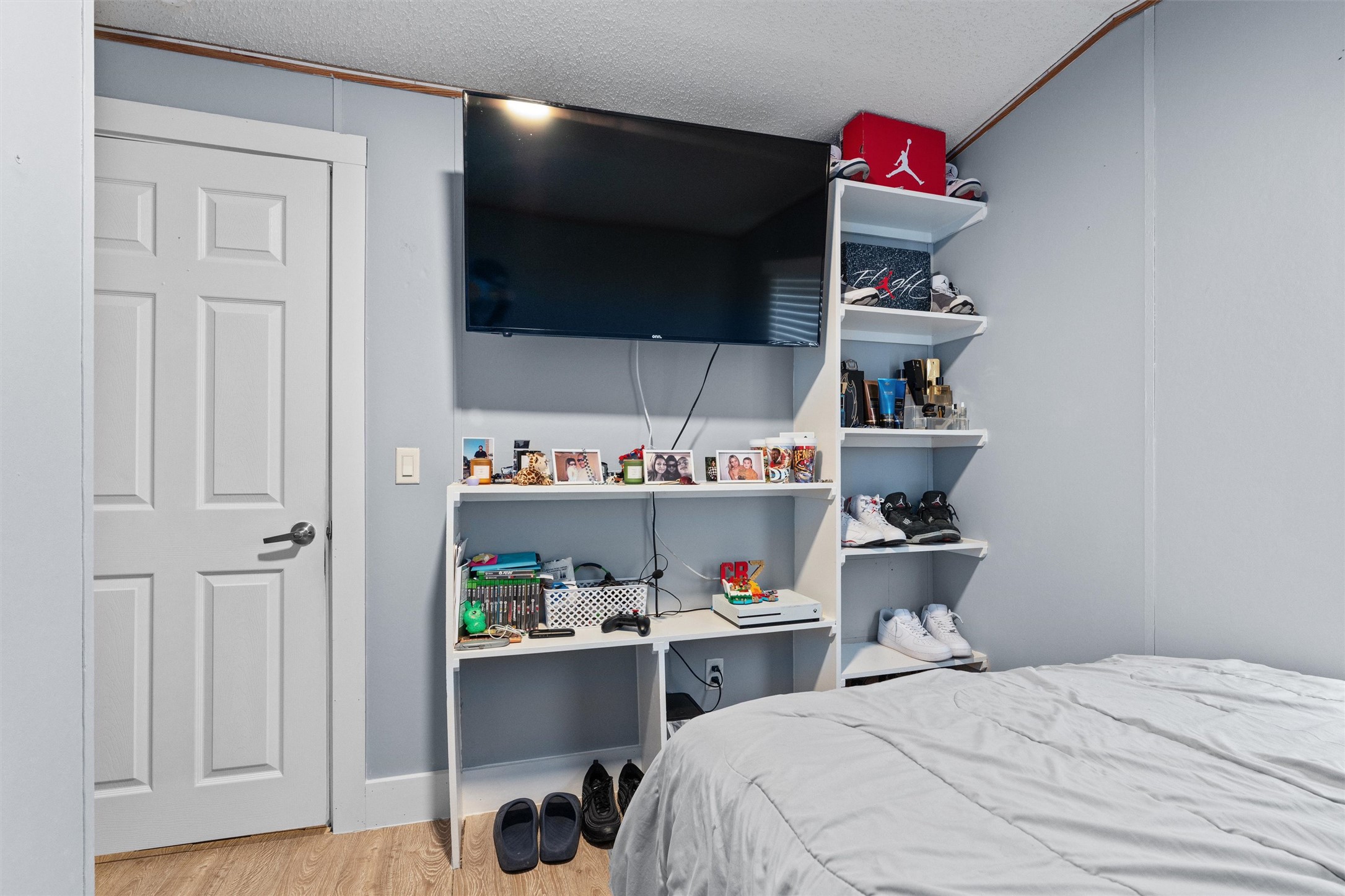 218 Boxcar Path Kyle, TX 78640 - Photo 12 of 21 Streamlined built-in shelving offers smart storage solutions in this inviting bedroom.
