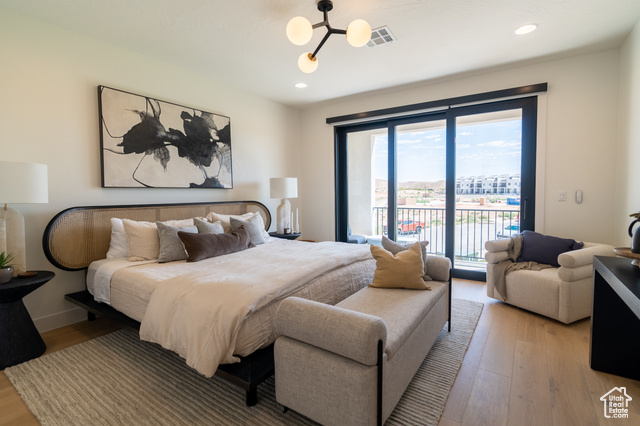 5366 Cyan Lane St. George, UT 84790 - Photo 22 of 39 Bedroom with access to exterior, light wood-type flooring, recessed lighting, and a chandelier