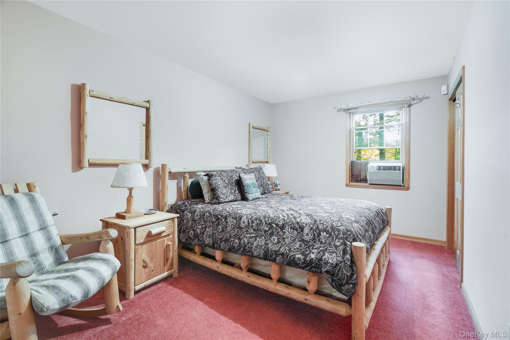 91 Decker Road Ancram, NY 12502 - Photo 12 of 35 a bedroom with a bed and a couch