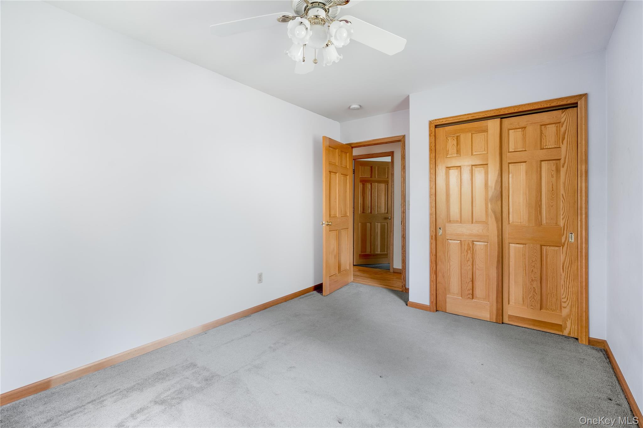 91 Decker Road Ancram, NY 12502 - Photo 15 of 35 an empty room with chandelier fan