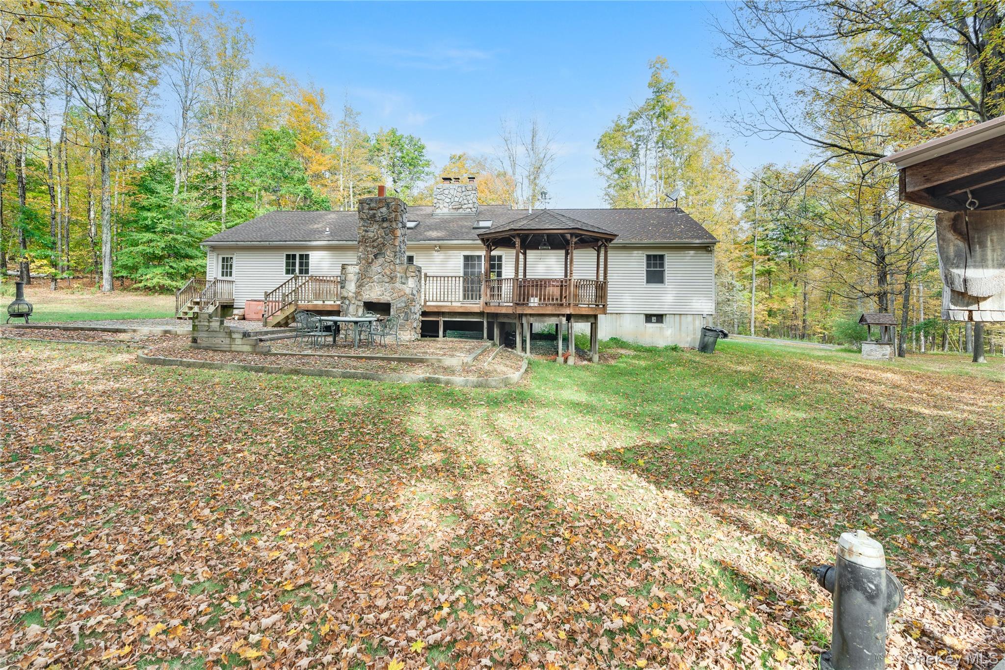 91 Decker Road Ancram, NY 12502 - Photo 19 of 35 a view of a house with backyard porch and sitting area