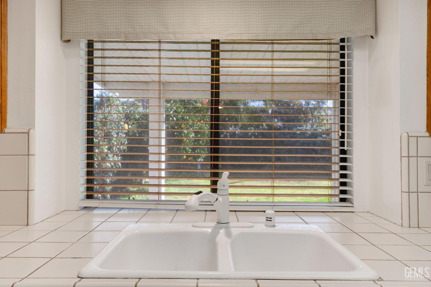 Undisclosed Address Bakersfield, CA 93311 - Photo 17 of 44 a view of a bathroom with a window