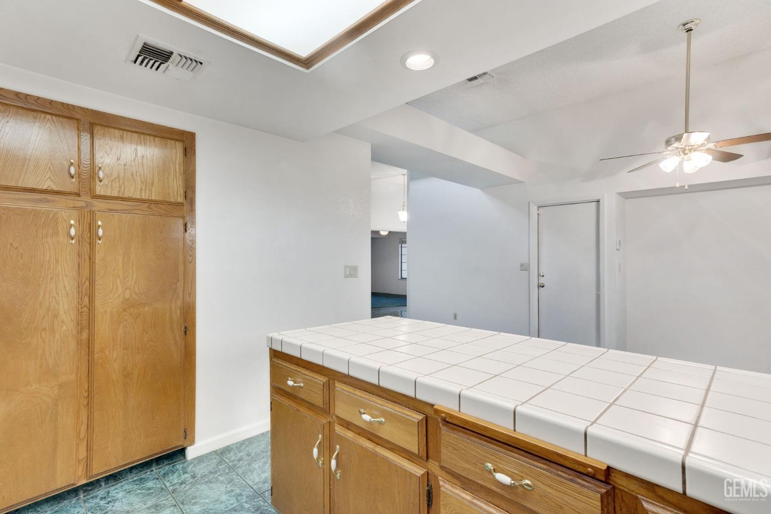 Undisclosed Address Bakersfield, CA 93311 - Photo 18 of 44 a bedroom with a bed and a dresser