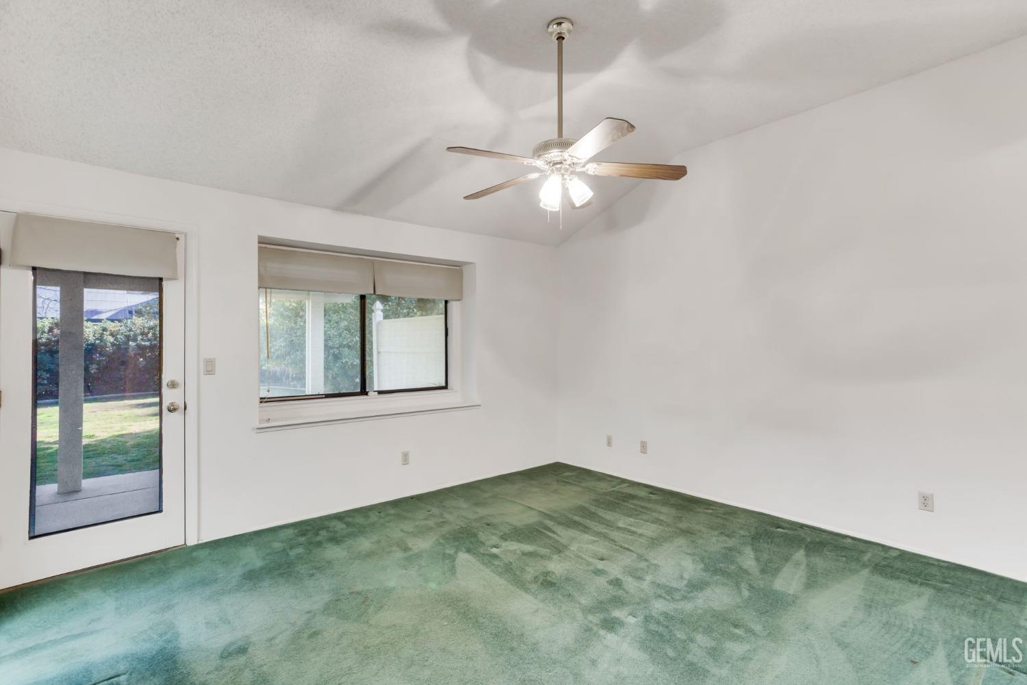 Undisclosed Address Bakersfield, CA 93311 - Photo 23 of 44 an empty room with windows and fan