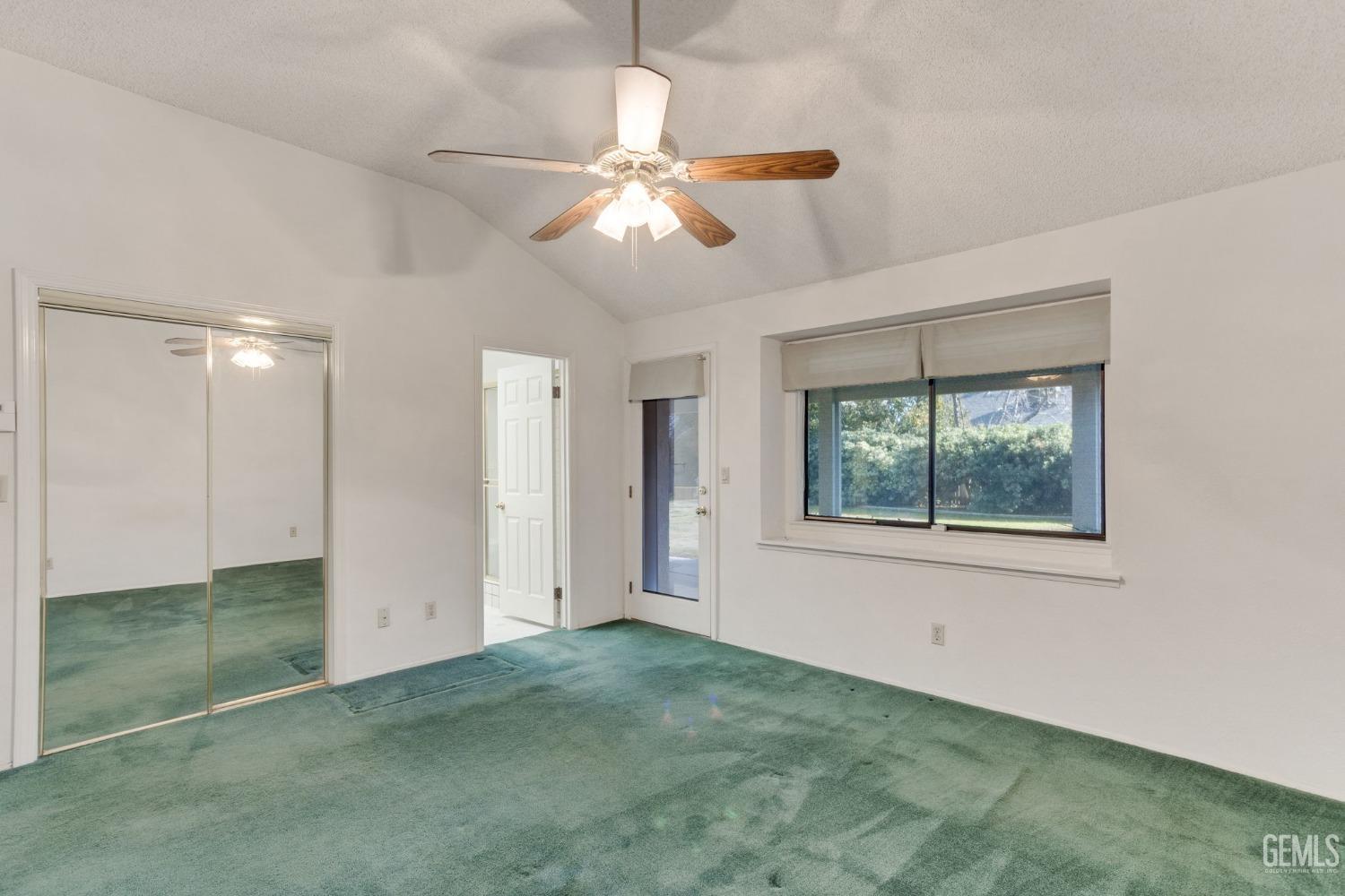 Undisclosed Address Bakersfield, CA 93311 - Photo 27 of 44 a view of an empty room with window and chandelier fan