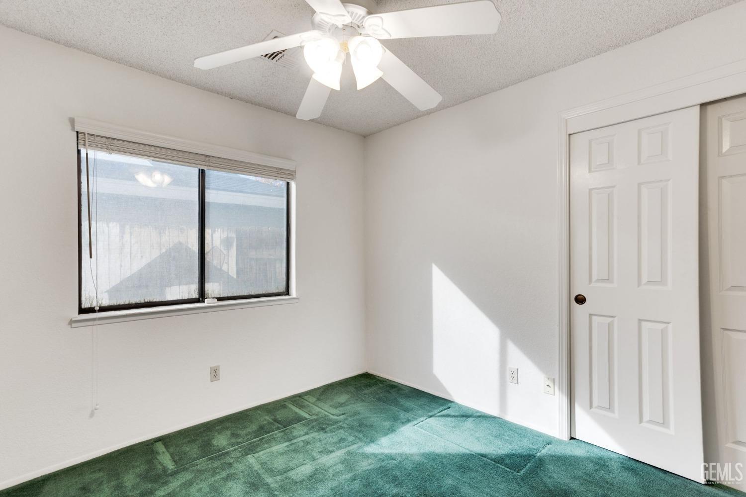 Undisclosed Address Bakersfield, CA 93311 - Photo 30 of 44 a view of a hallway with a small yard