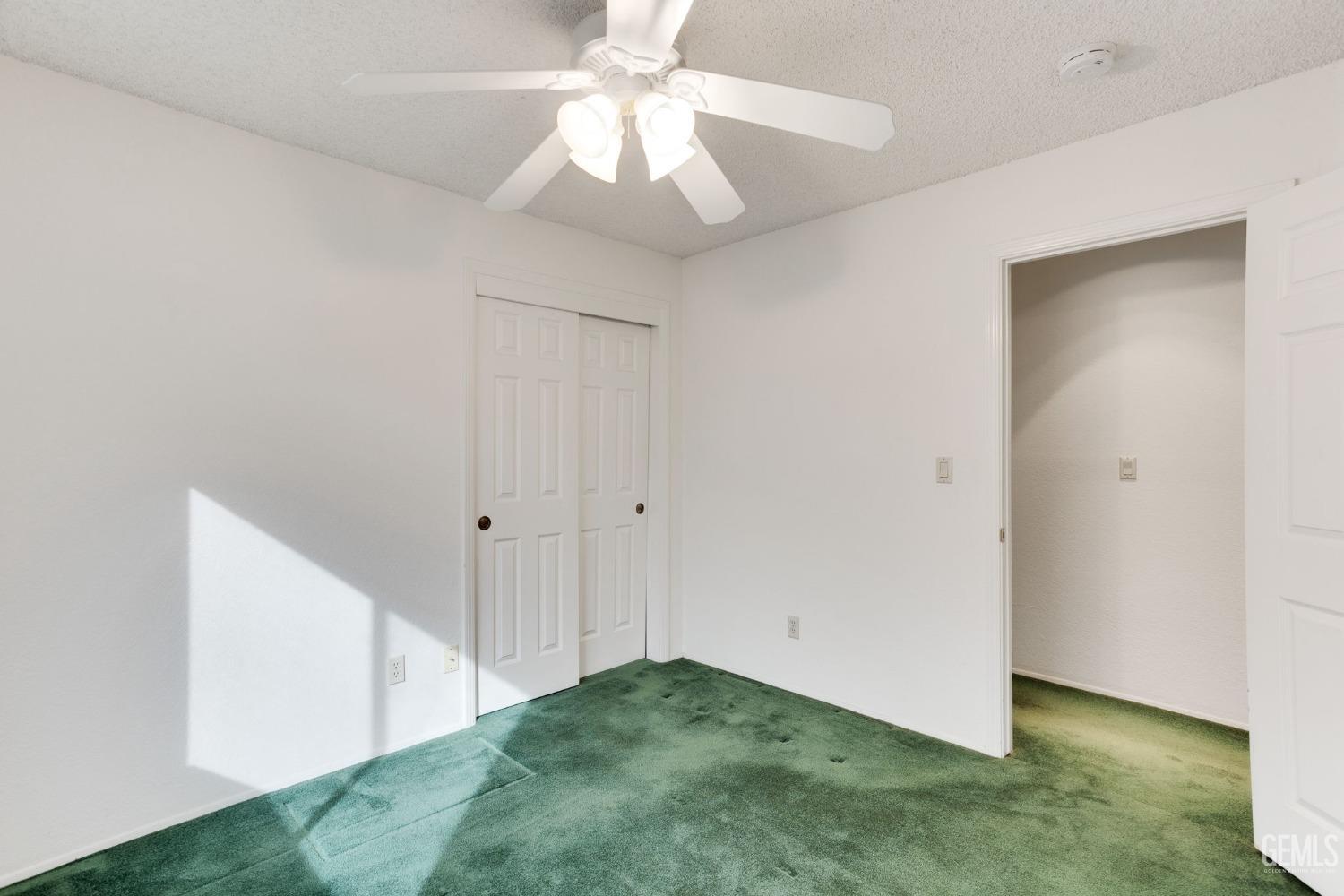 Undisclosed Address Bakersfield, CA 93311 - Photo 31 of 44 a view of an empty room and chandelier fan