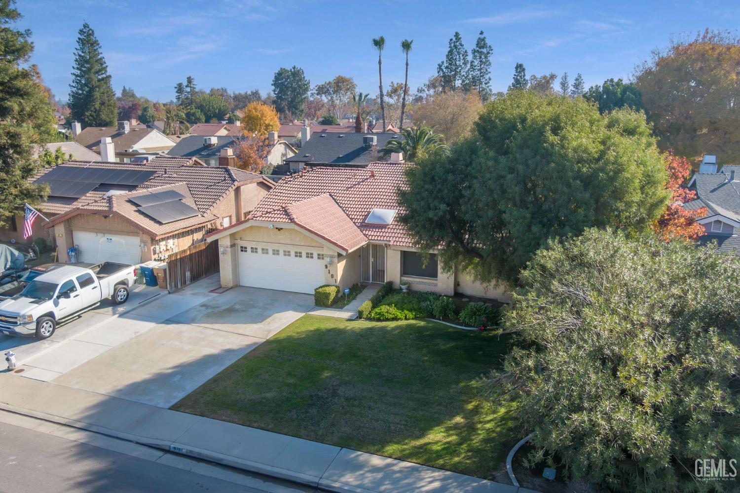 Undisclosed Address Bakersfield, CA 93311 - Photo 4 of 44 a view of a house with a yard