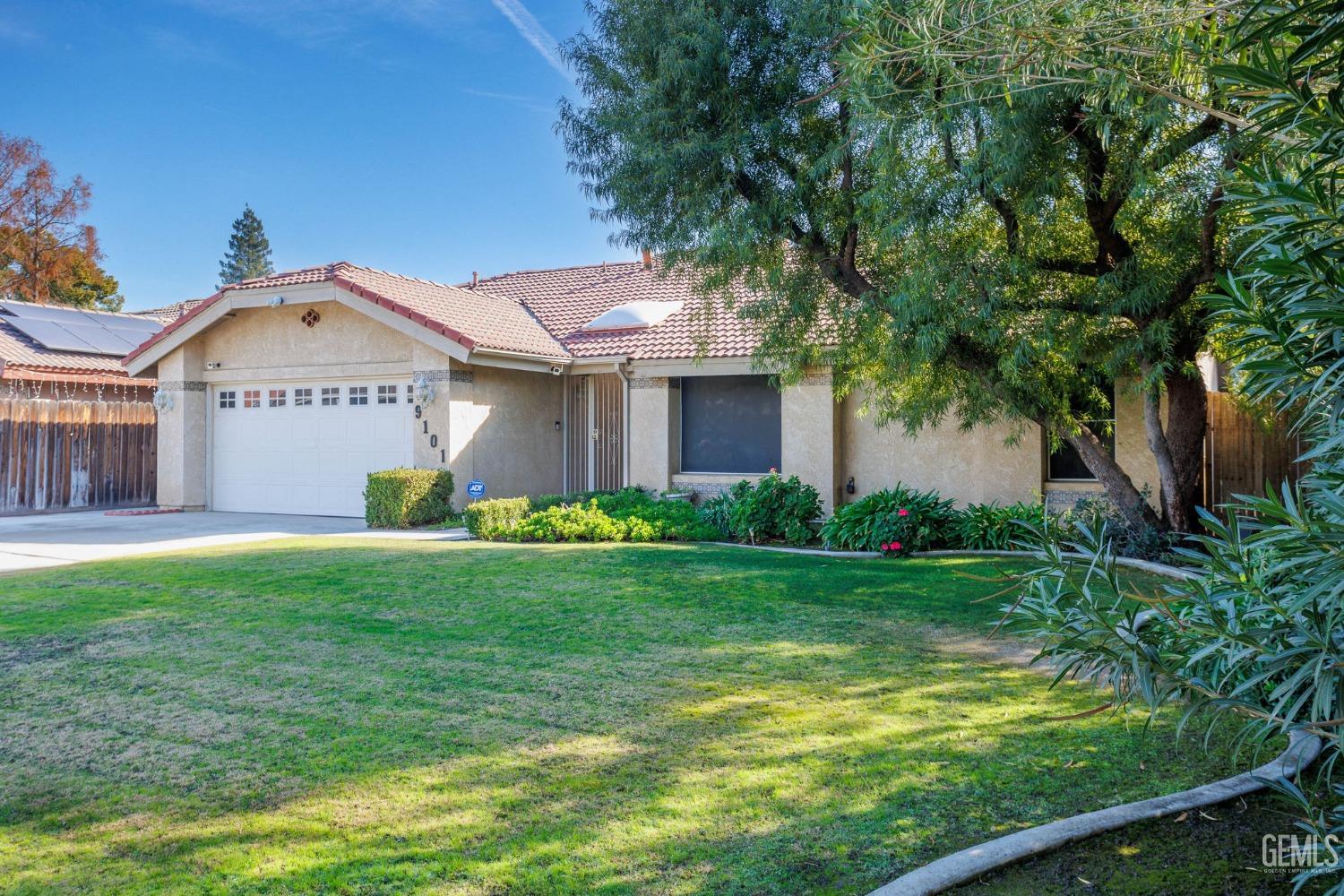 Undisclosed Address Bakersfield, CA 93311 - Photo 43 of 44 a front view of a house with garden