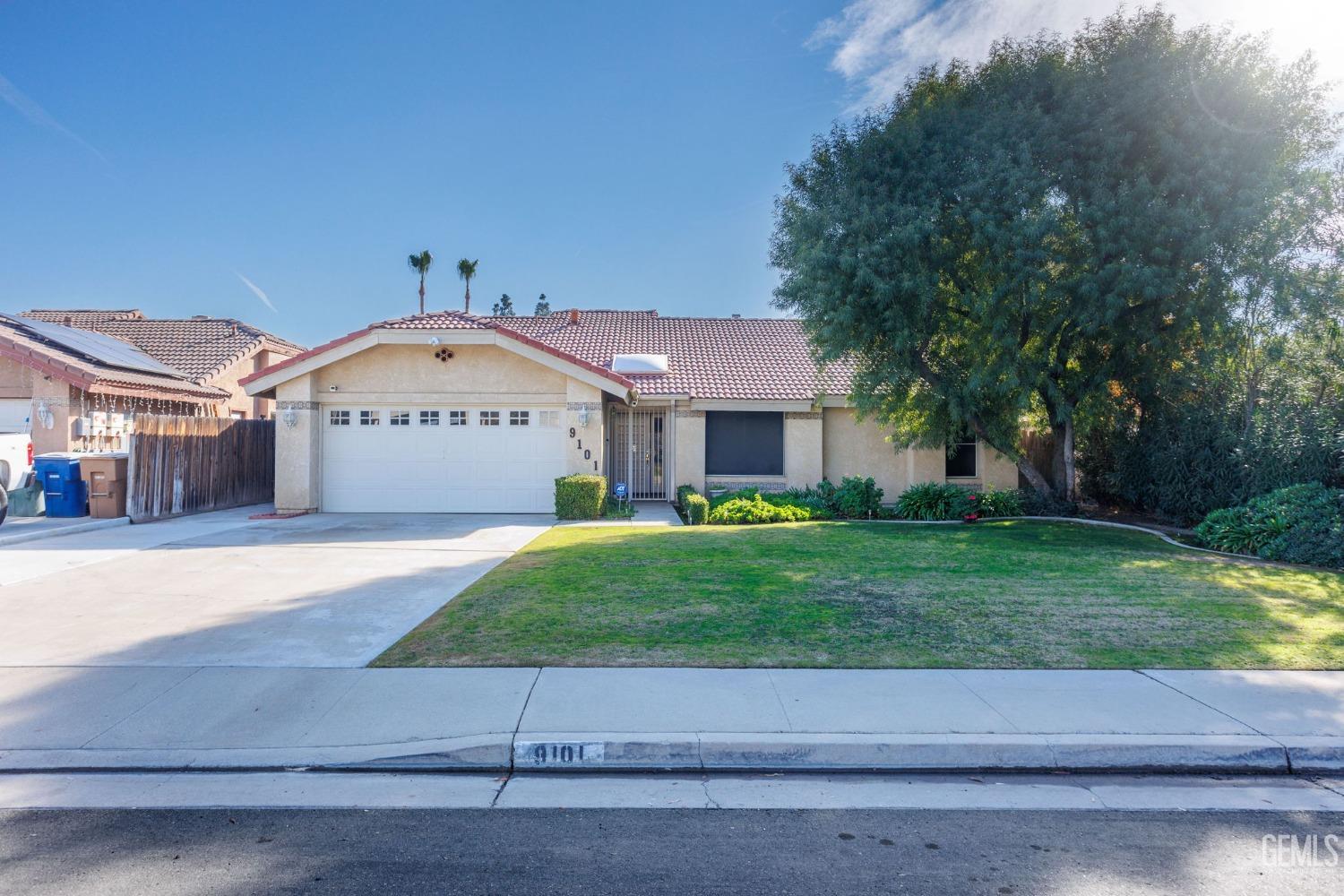 Undisclosed Address Bakersfield, CA 93311 - Photo 5 of 44 a front view of a house with a yard