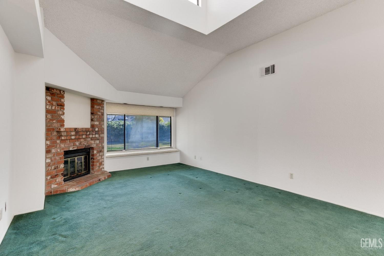Undisclosed Address Bakersfield, CA 93311 - Photo 10 of 44 a view of empty room with a fireplace