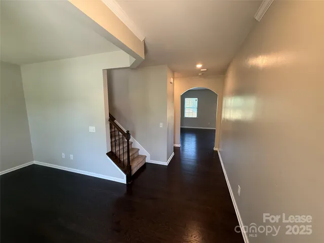 a view of gallery with wooden floor