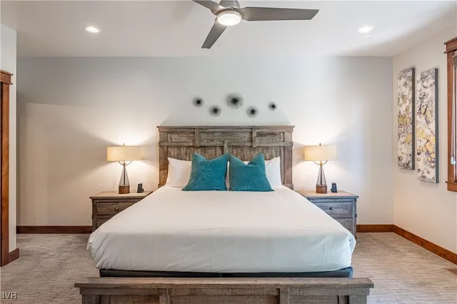 a bedroom with a bed and a lamp