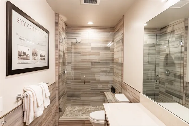 a bathroom with a bathtub and shower